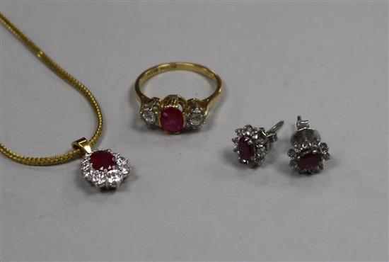An 18ct gold and platinum ruby and diamond three stone ring, a ruby and diamond cluster pendant on a 9ct gold chain etc.
